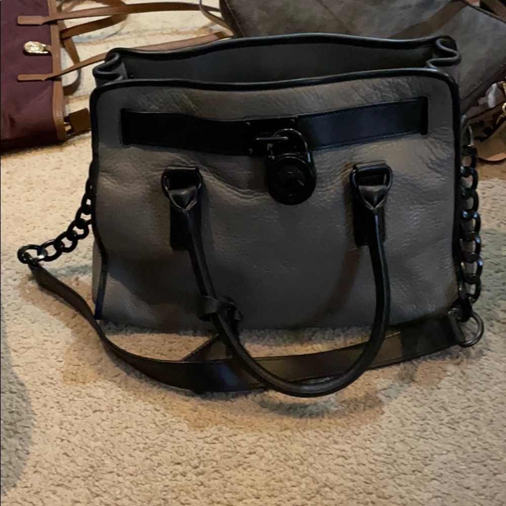 Gray and black Michael kors bag